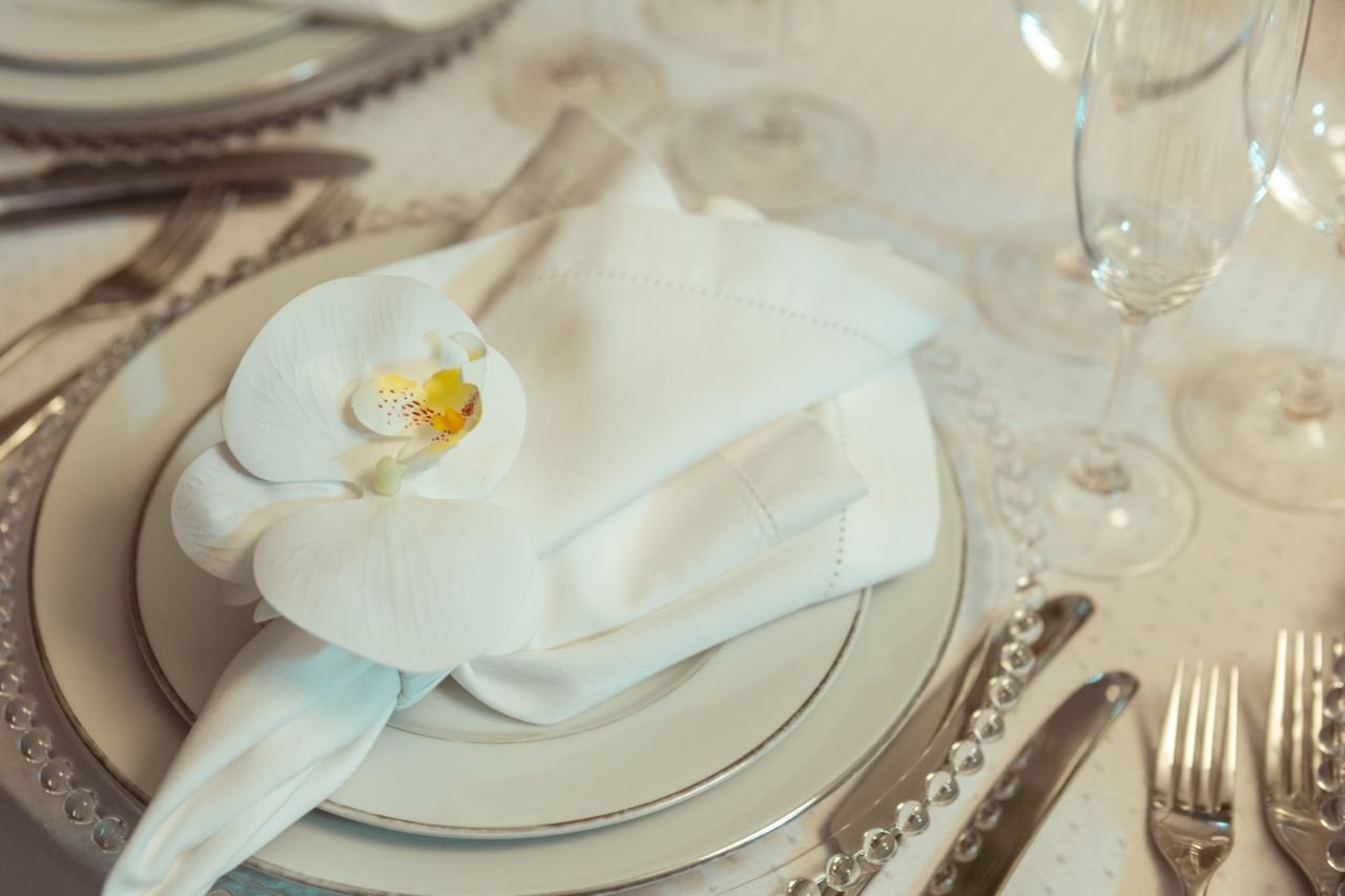 China and flatware arranged on an event table
